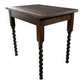 Solid wood coffee table with twisted legs, early 20th century.