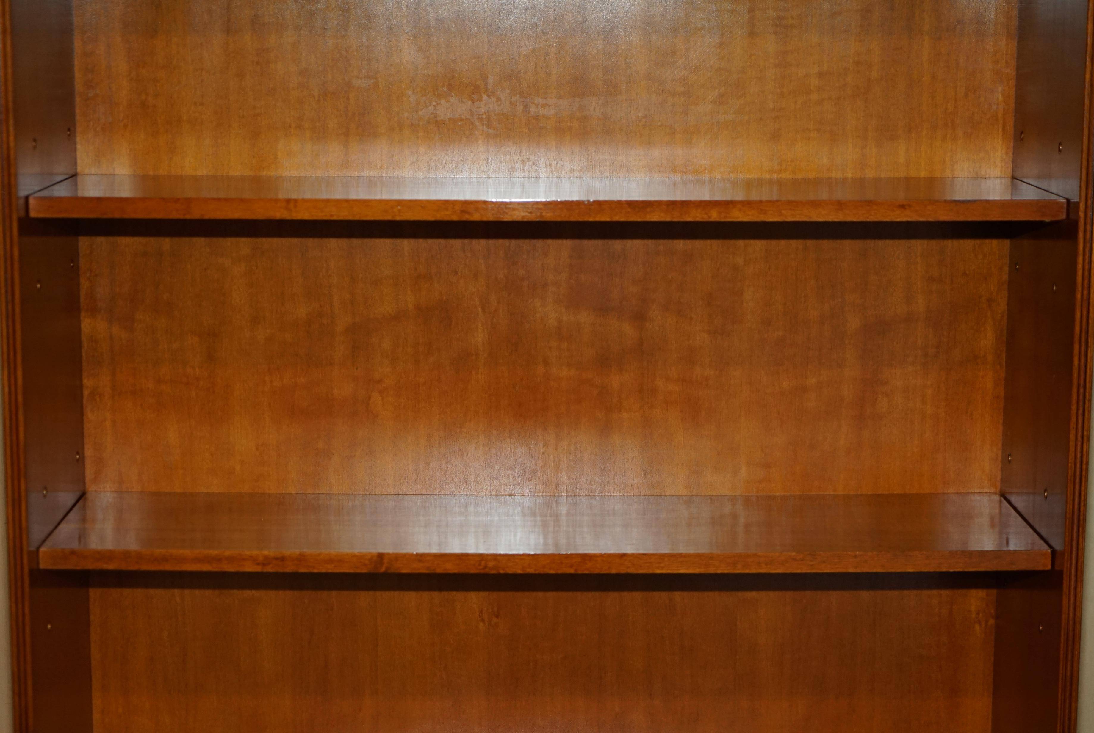Open library Bradley Furniture made of yew wood with a cupboard base.