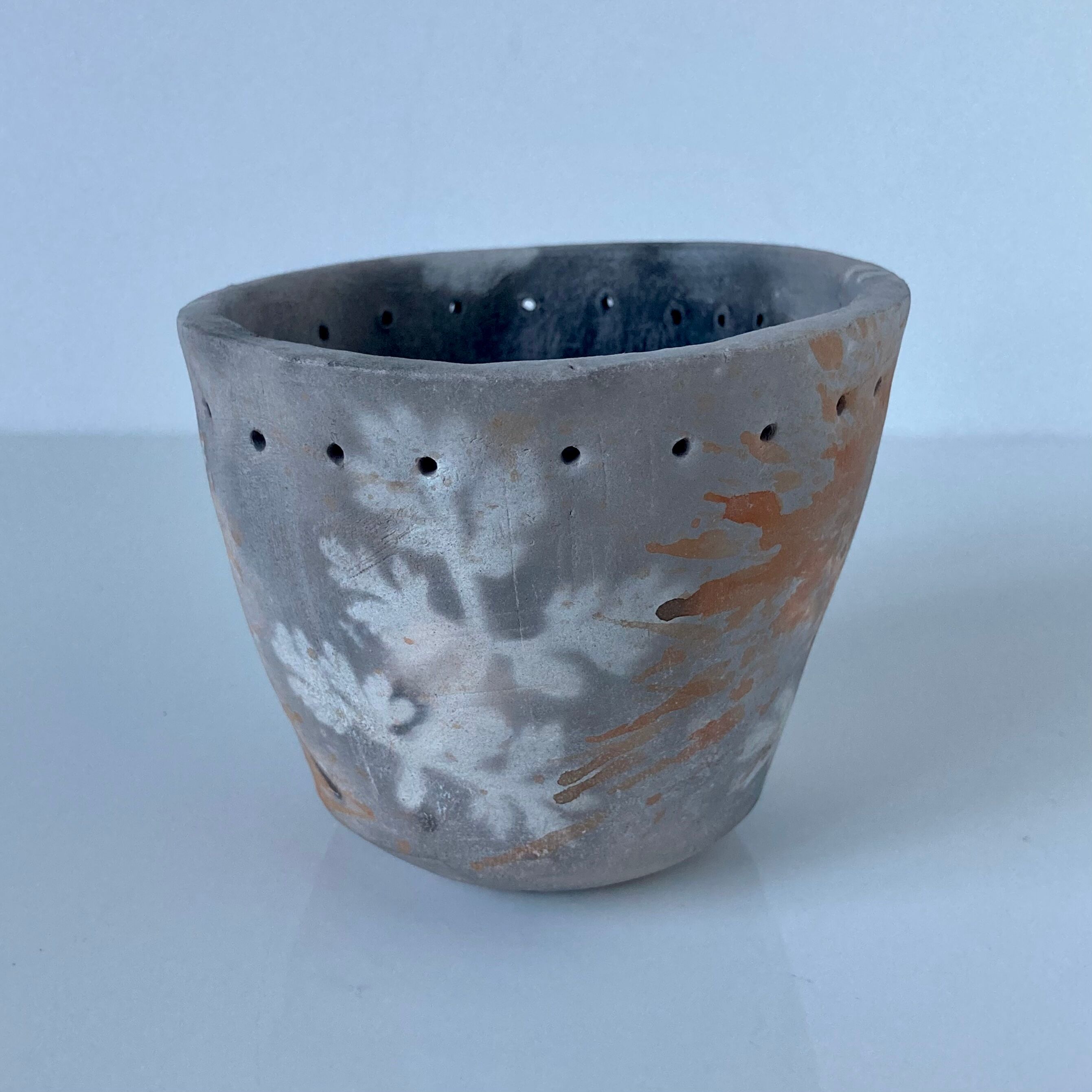 Signed ceramic pot with plant decoration