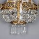 Antique wall sconces in gilded bronze with neoclassical motifs, 20th century.