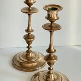 Pair of antique candle holders in solid brass