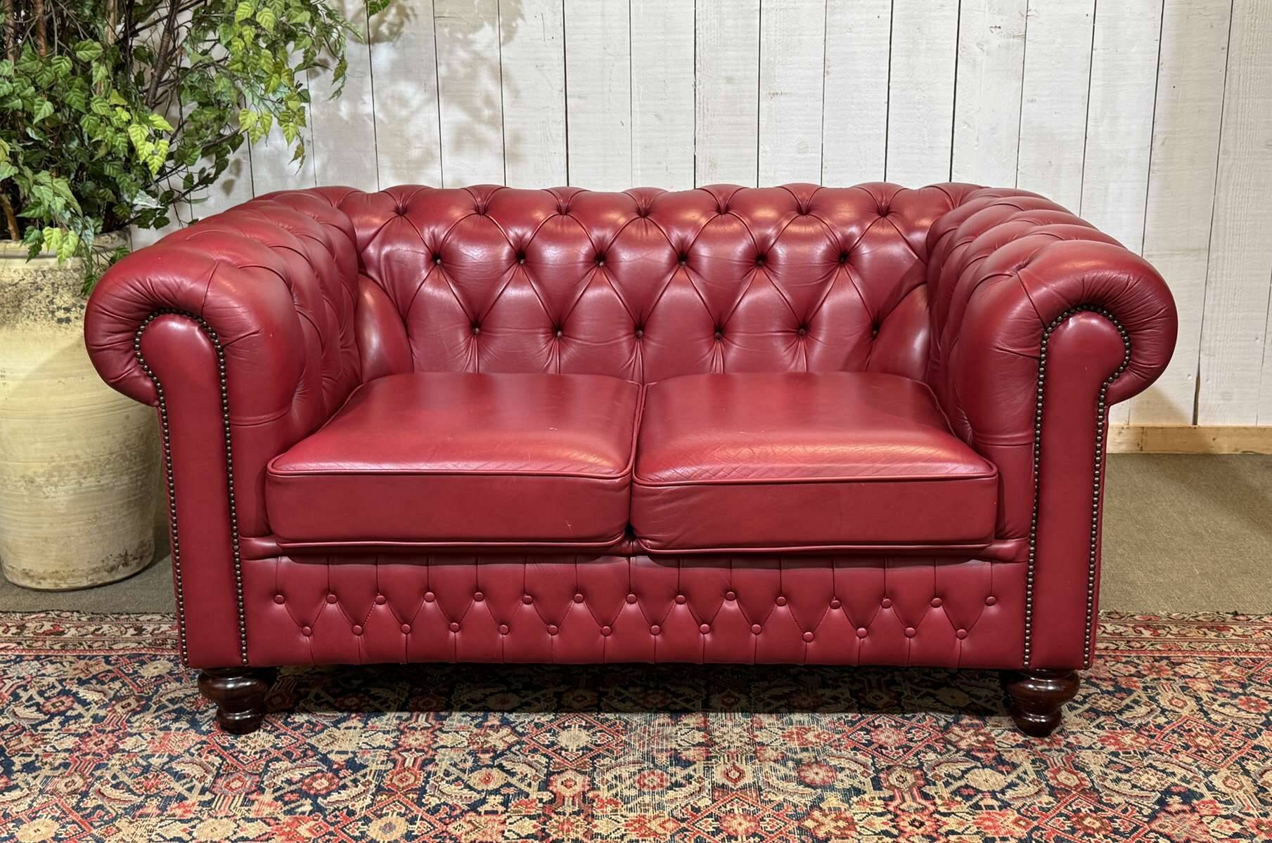 Chesterfield 2-seater leather sofa, modern production from the 2000s.