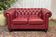Chesterfield 2-seater leather sofa, modern production from the 2000s.