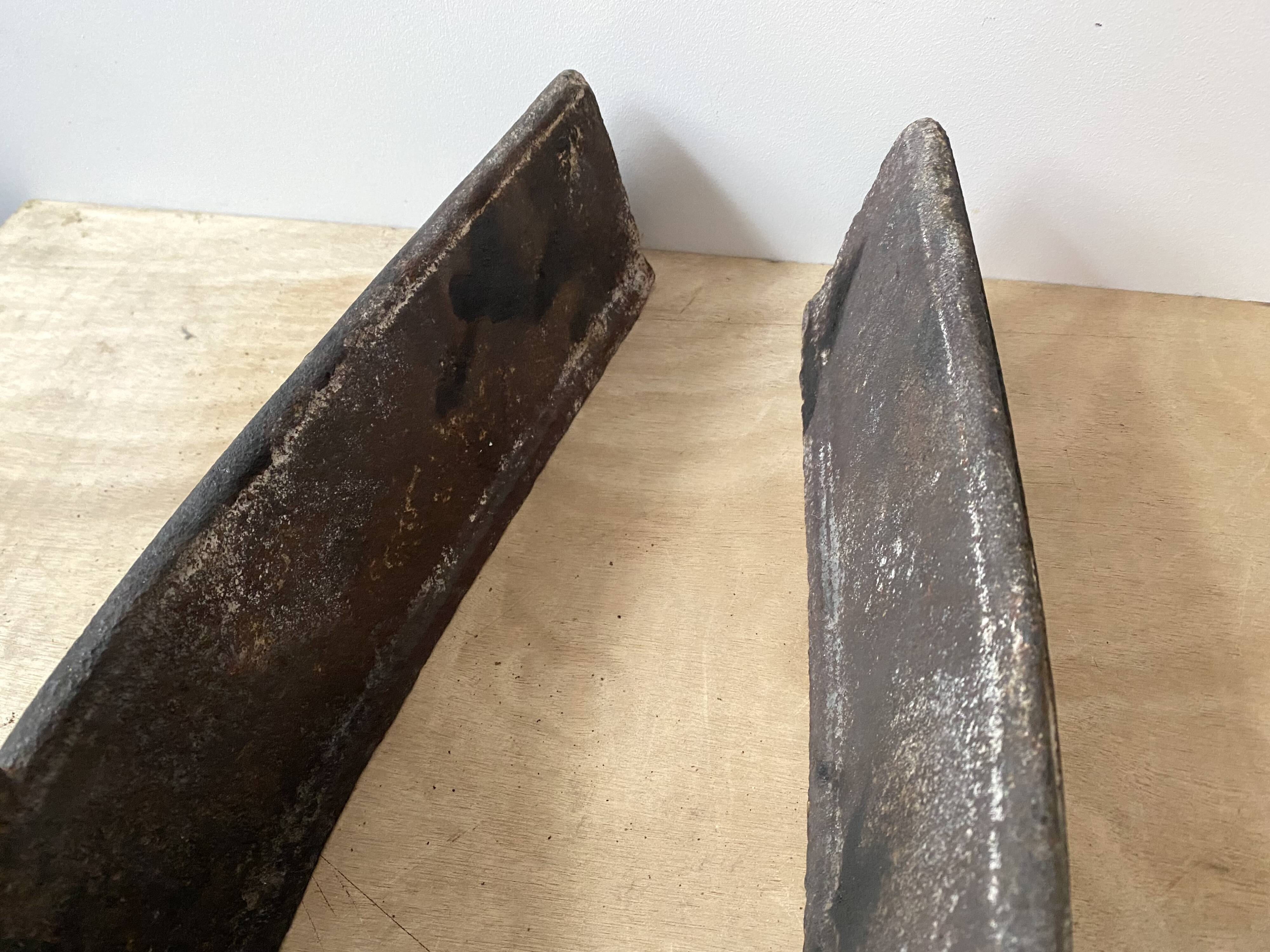 Pair of modernist anthropomorphic fireplace andirons, brutalist log holders 1950s