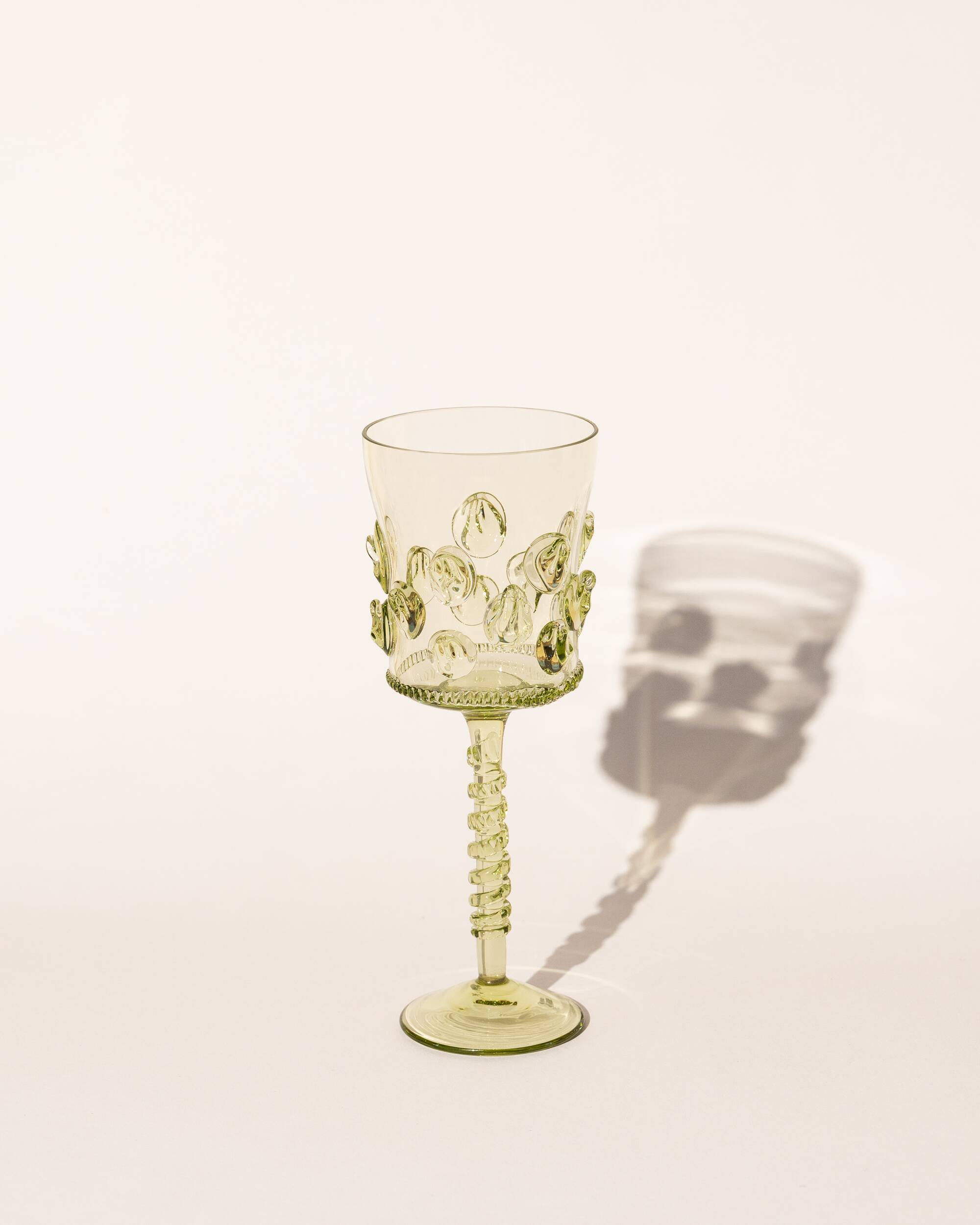 pair of blown wine glasses - green