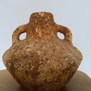 Textured terracotta vase in wabi-sabi style