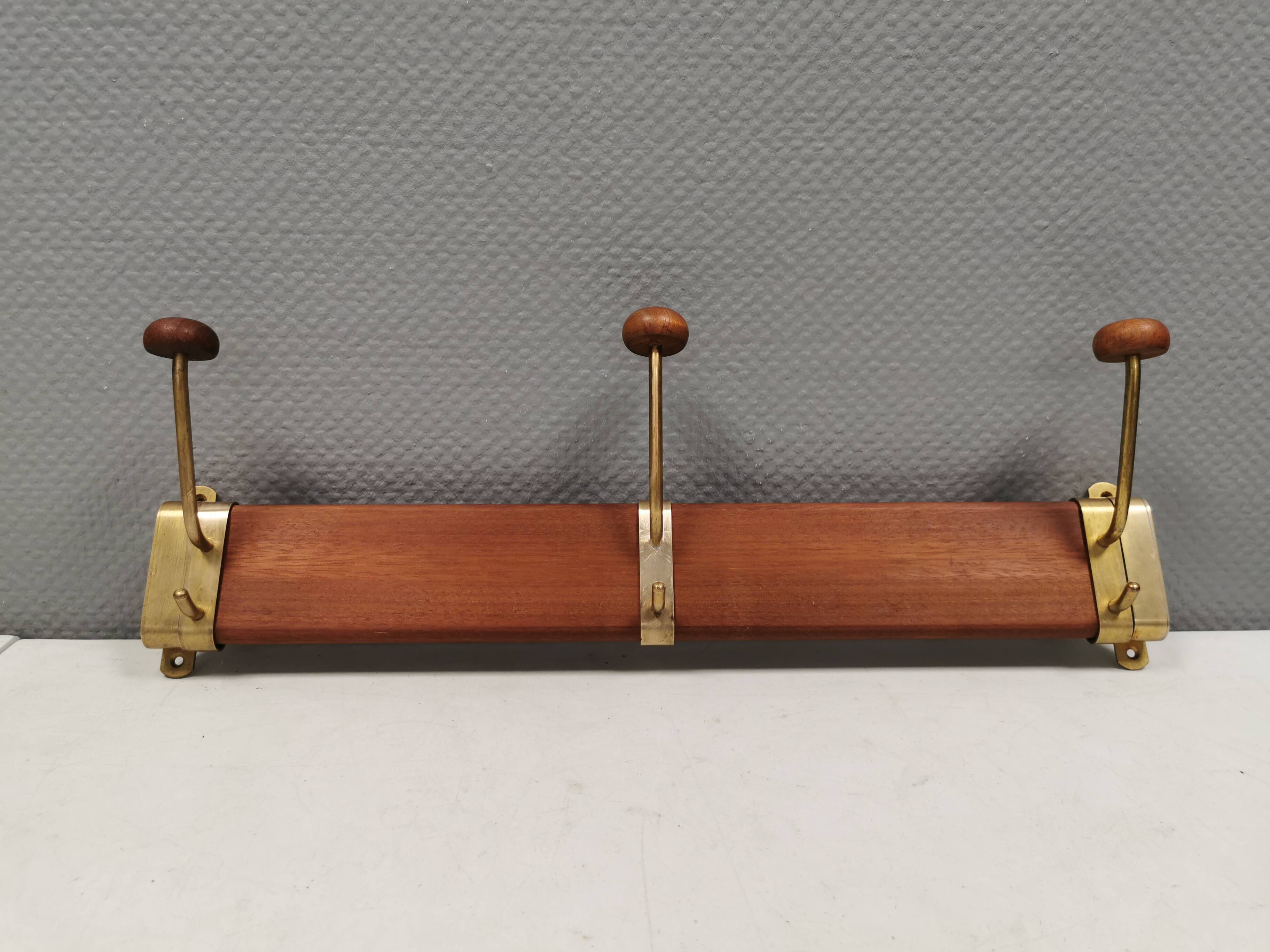 Danish teak and brass coat rack with adjustable hooks, 1960s.