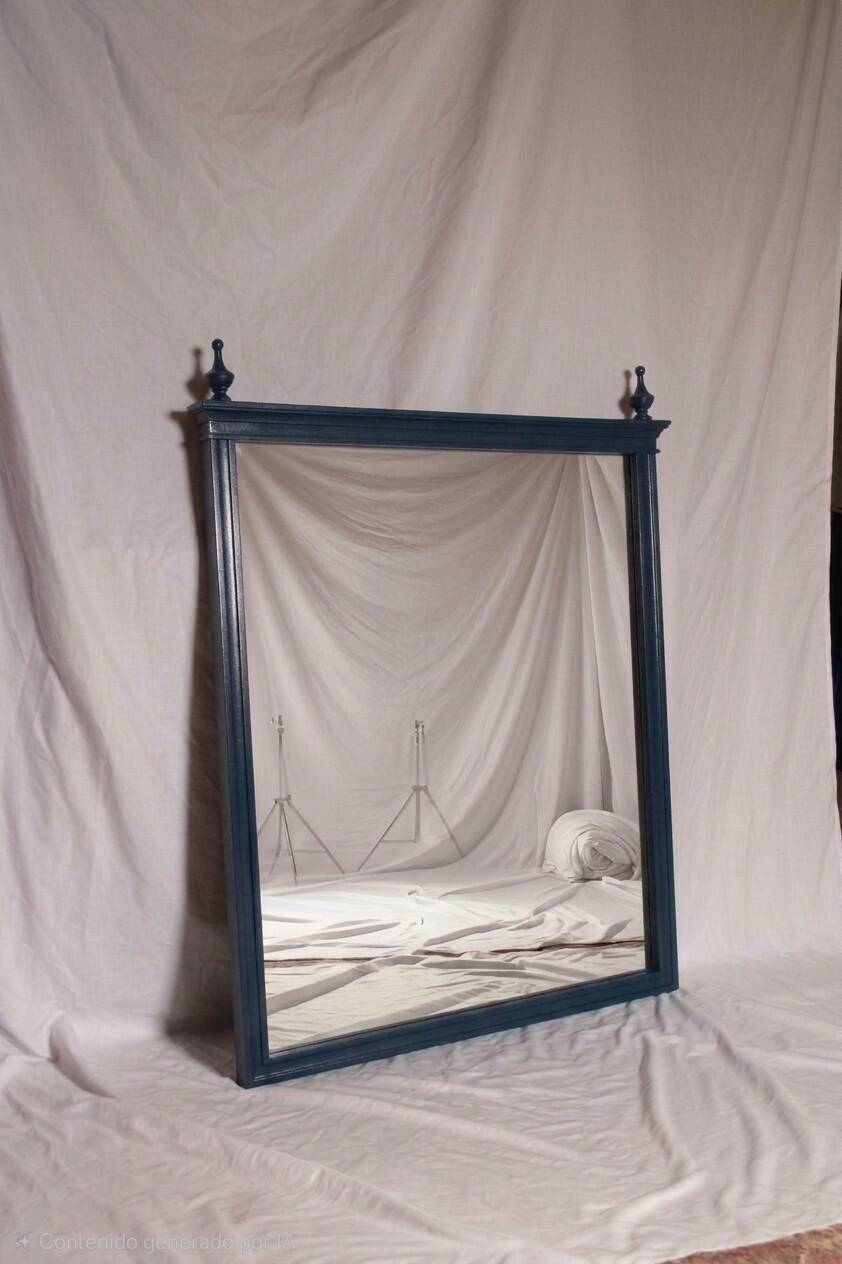 Restored vintage mirror in navy blue, Louis XVI style.