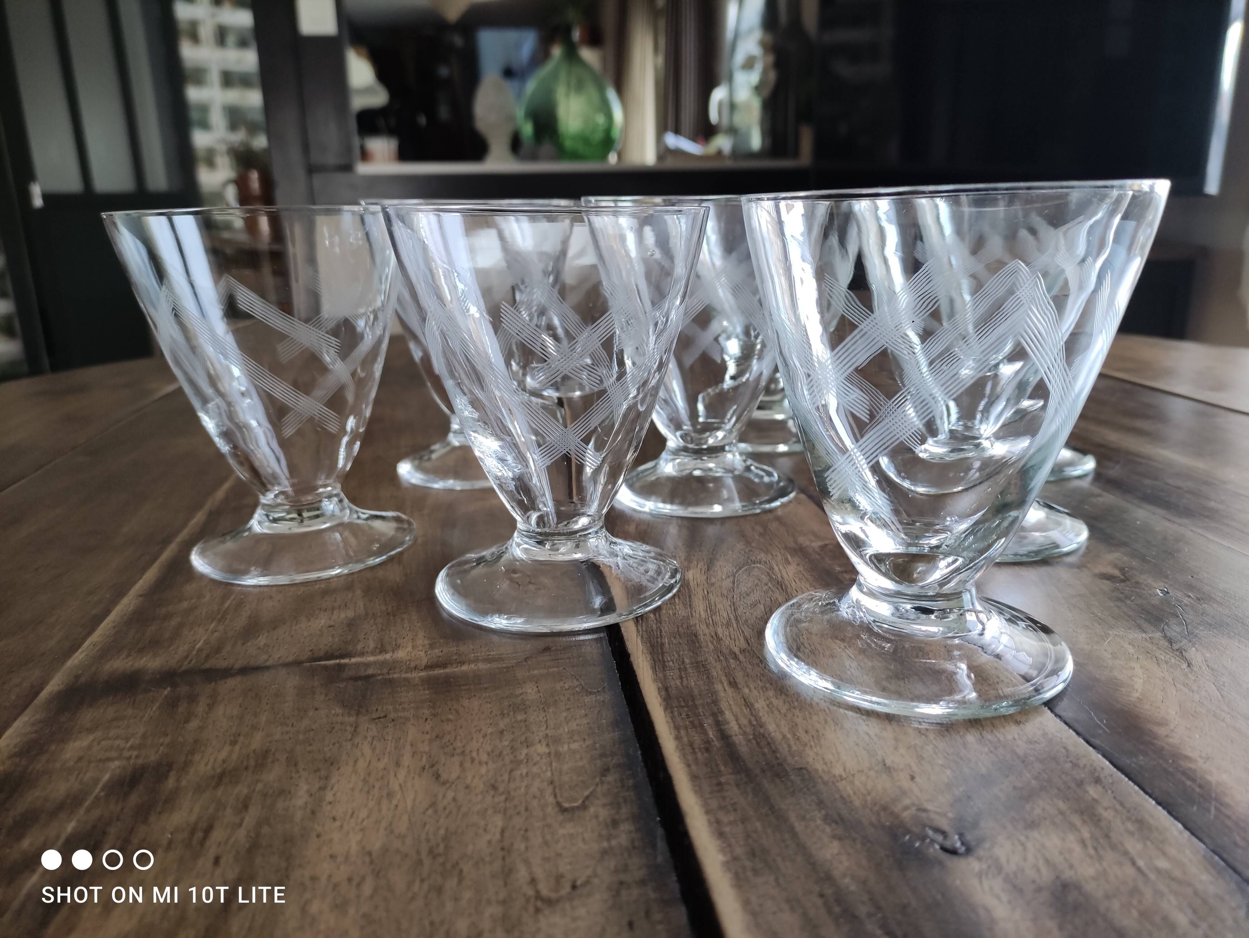 Set of 9 conical glasses on pedestal in antique chiseled glass crosses