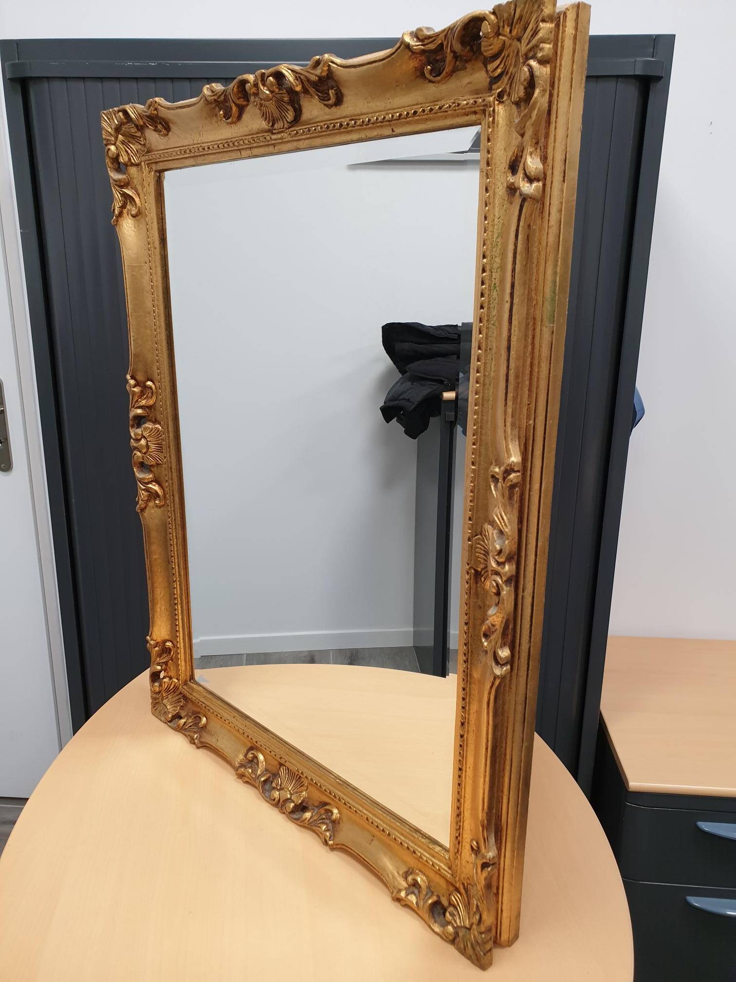 Beveled mirror and golden wood