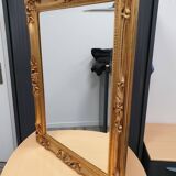 Beveled mirror and golden wood
