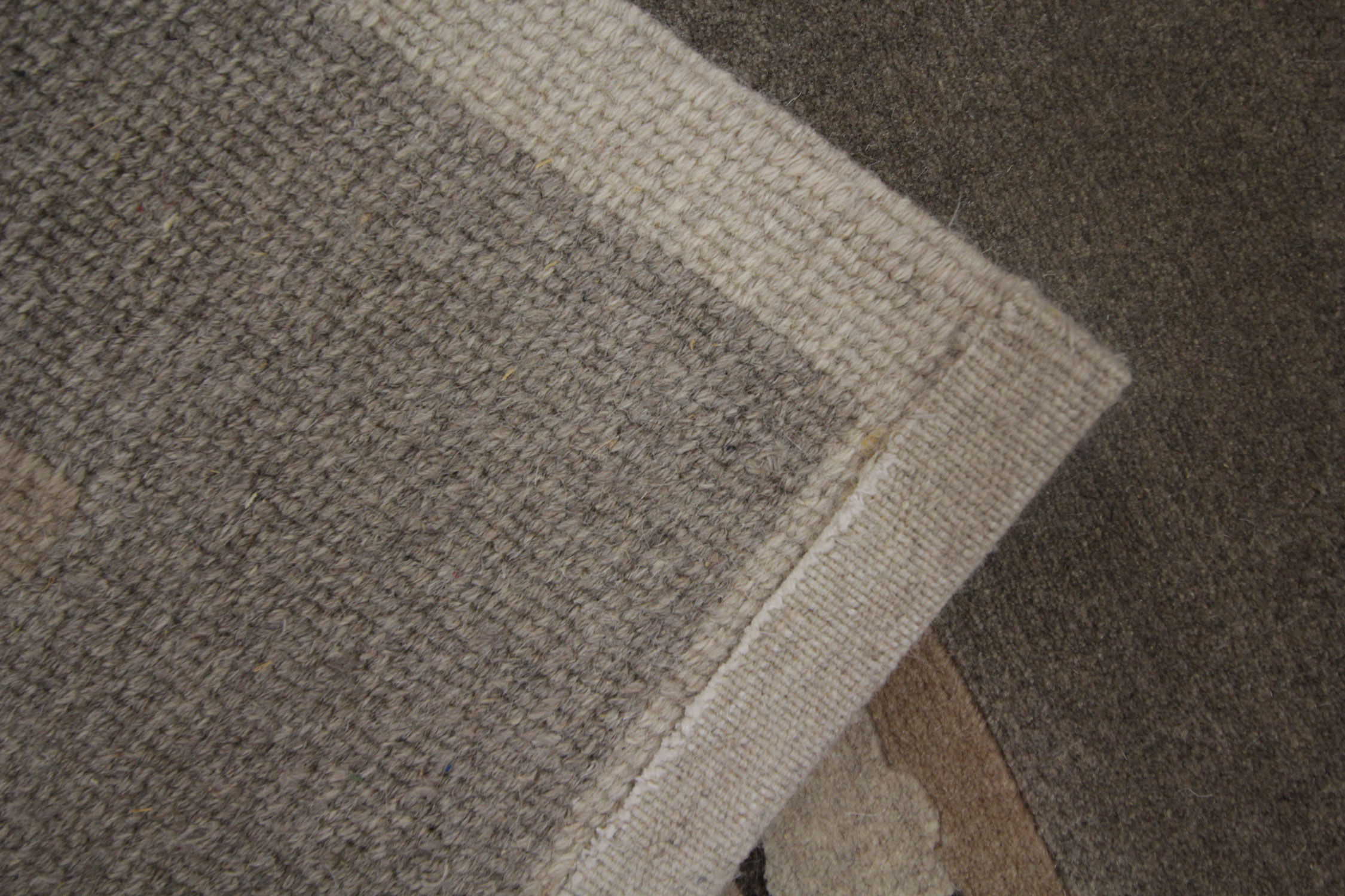 Handwoven matt cream wool carpet 61x91 cm