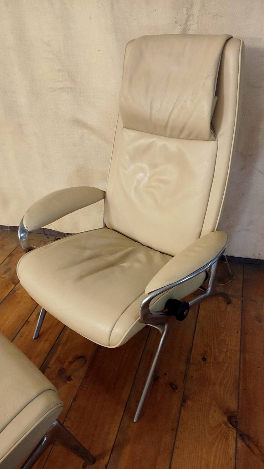 Beige leather armchair and footstool