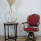 Vintage captain's chair in wood and garnet fabric — a seat with character