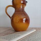 Orange glazed ceramic pitcher