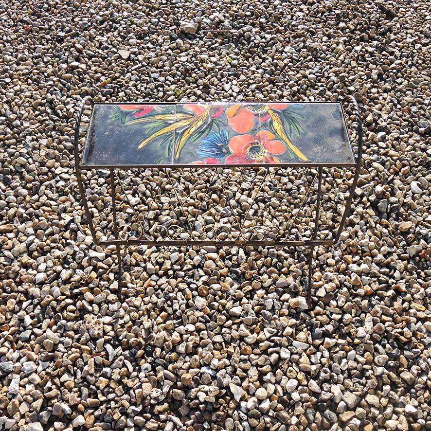 Antique wrought iron and ceramic magazine rack