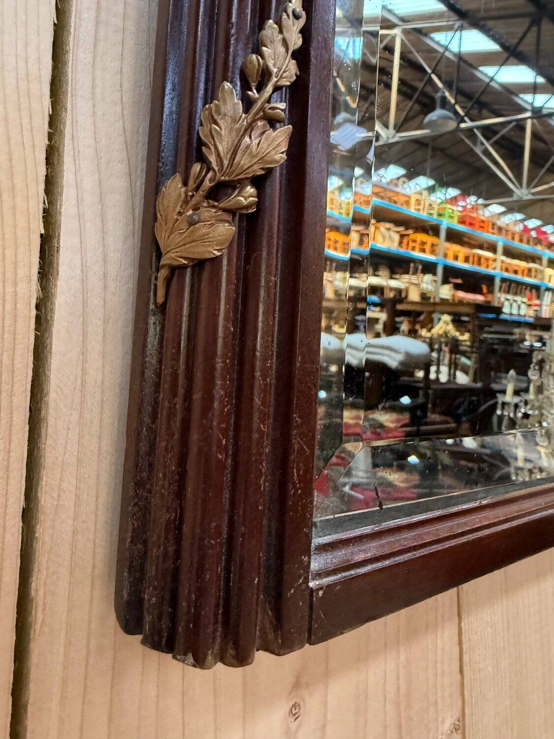 Louis XVI style mirror in mahogany and gold.