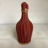Petite bouteille décorative osier rouge bordeaux