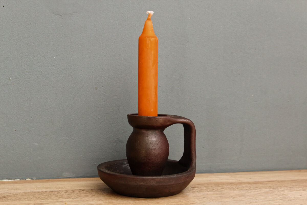 Small hand-held candlestick, signed