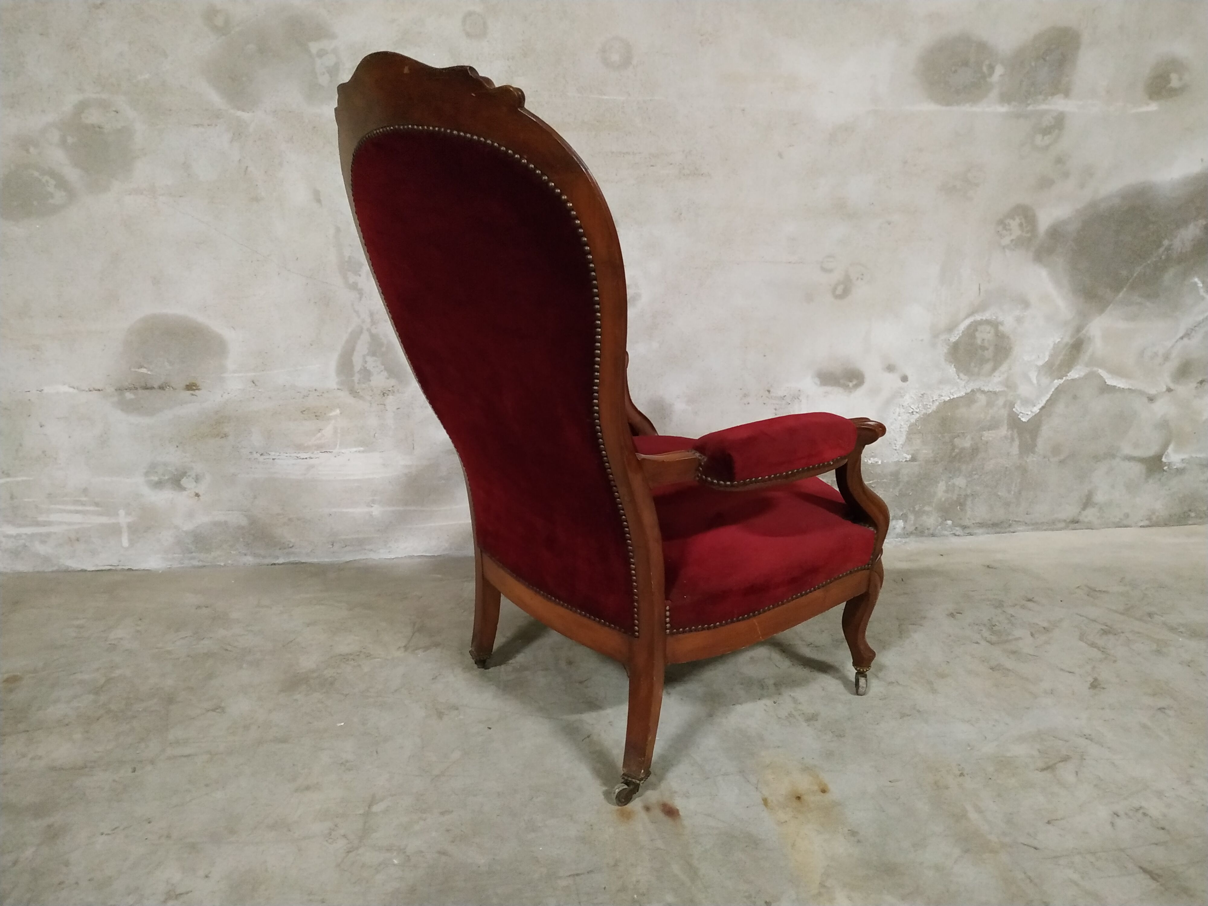 Walnut and velvet armchair