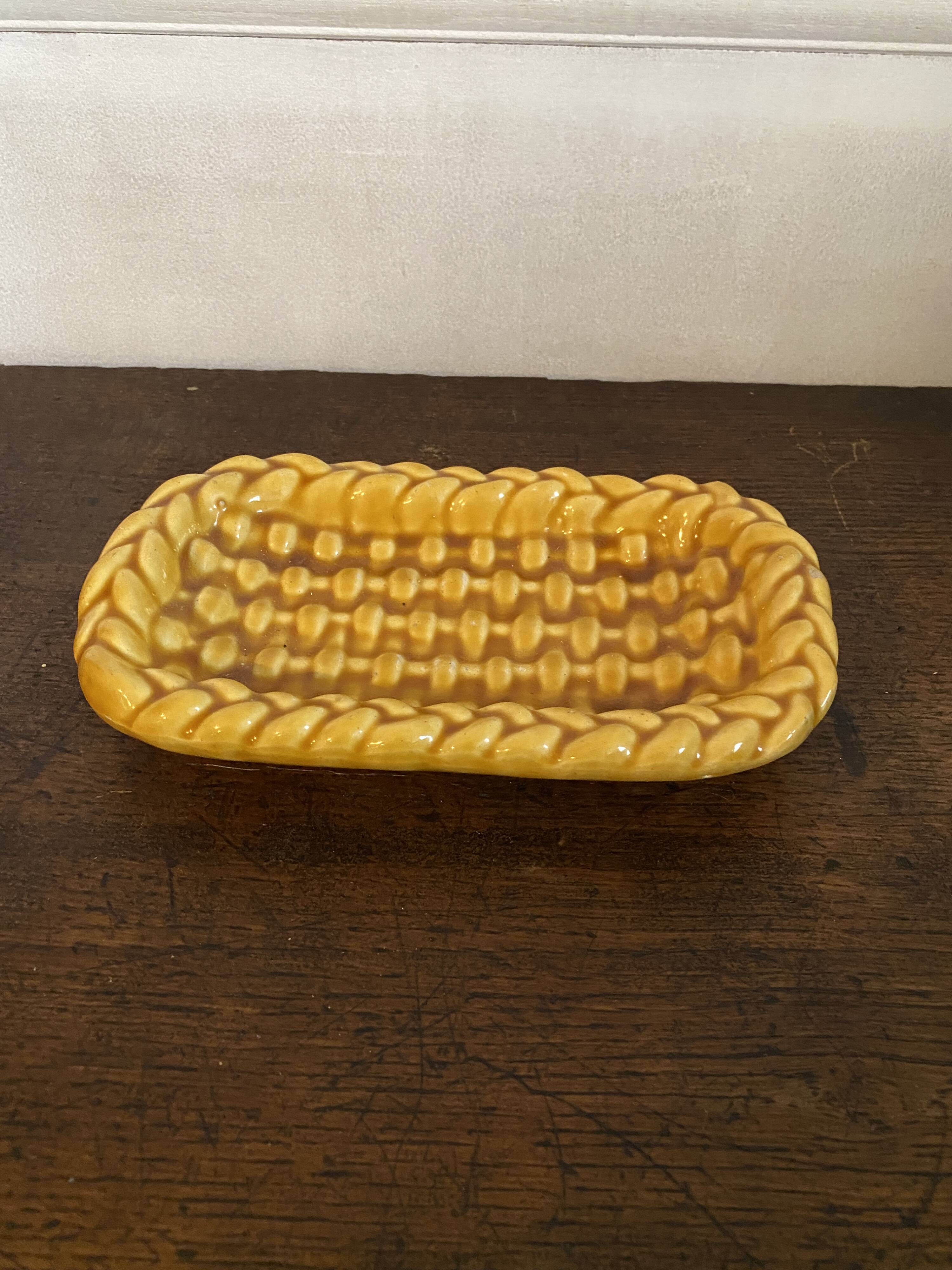 Mustard braided slip pocket emptier