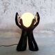 Black and white opaline hand lamp.