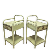 Copy of a pair of patinated metal bedside tables.