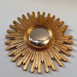 Old large golden sun mirror with rounded witch's eye in vintage resin from the 70s