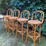 Set of four cane and webbing bar stools