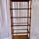 Classic wooden shelves, glass tops and cannage