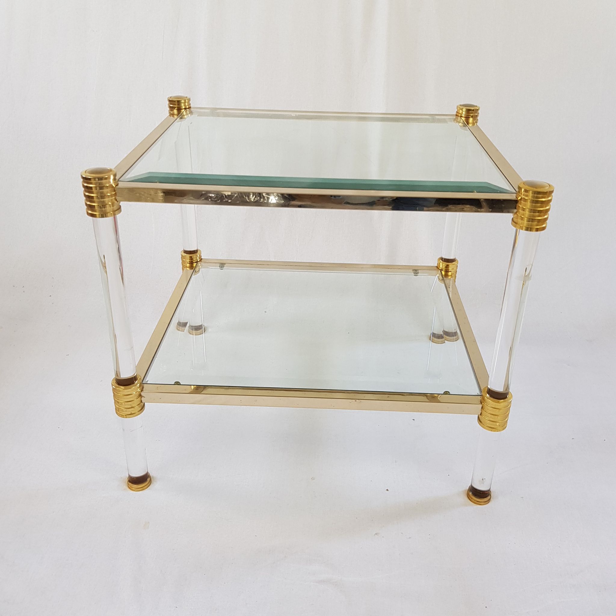 Table basse en lucite et acier doré