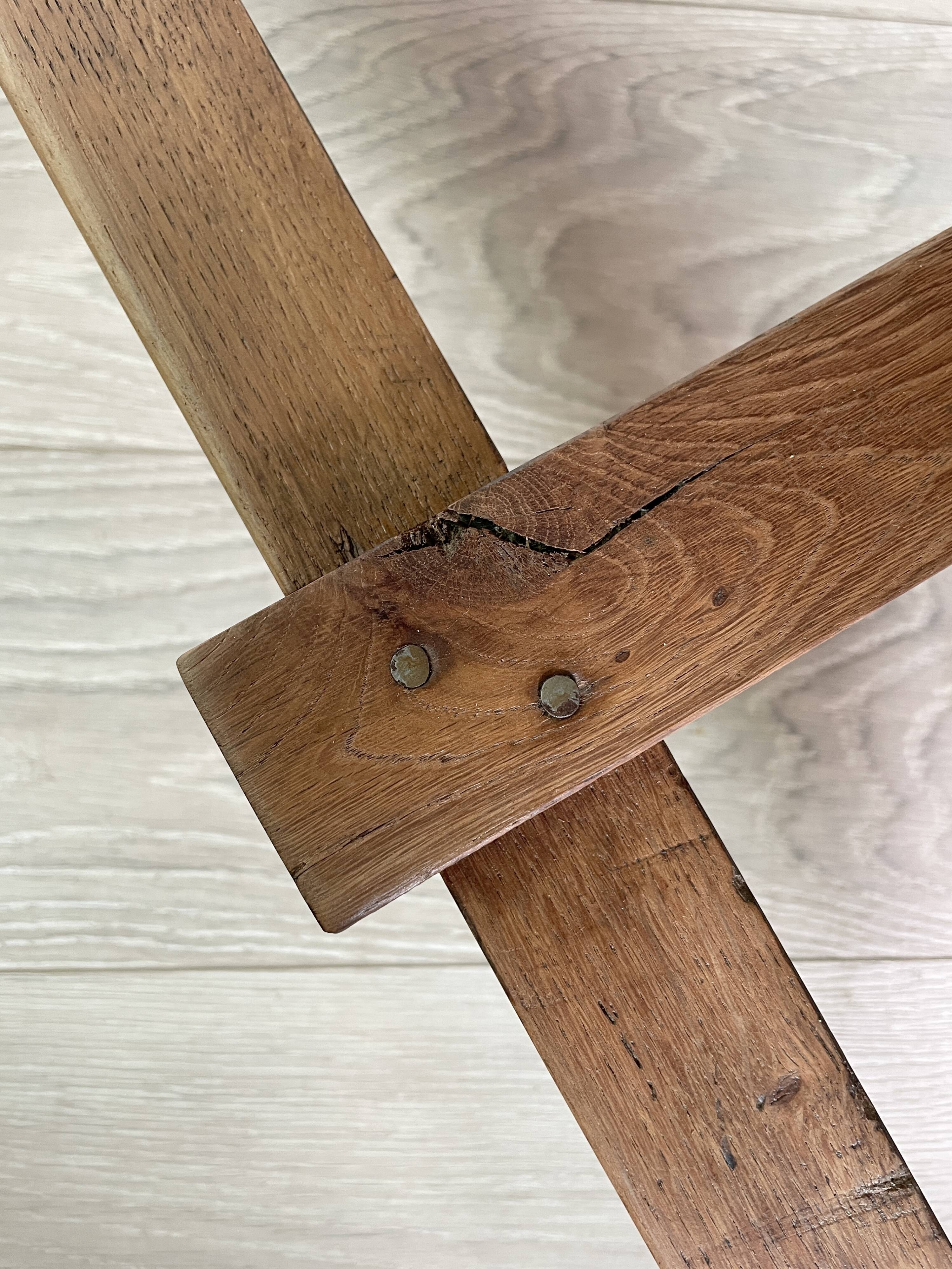 Solid wood workshop table with straight legs.