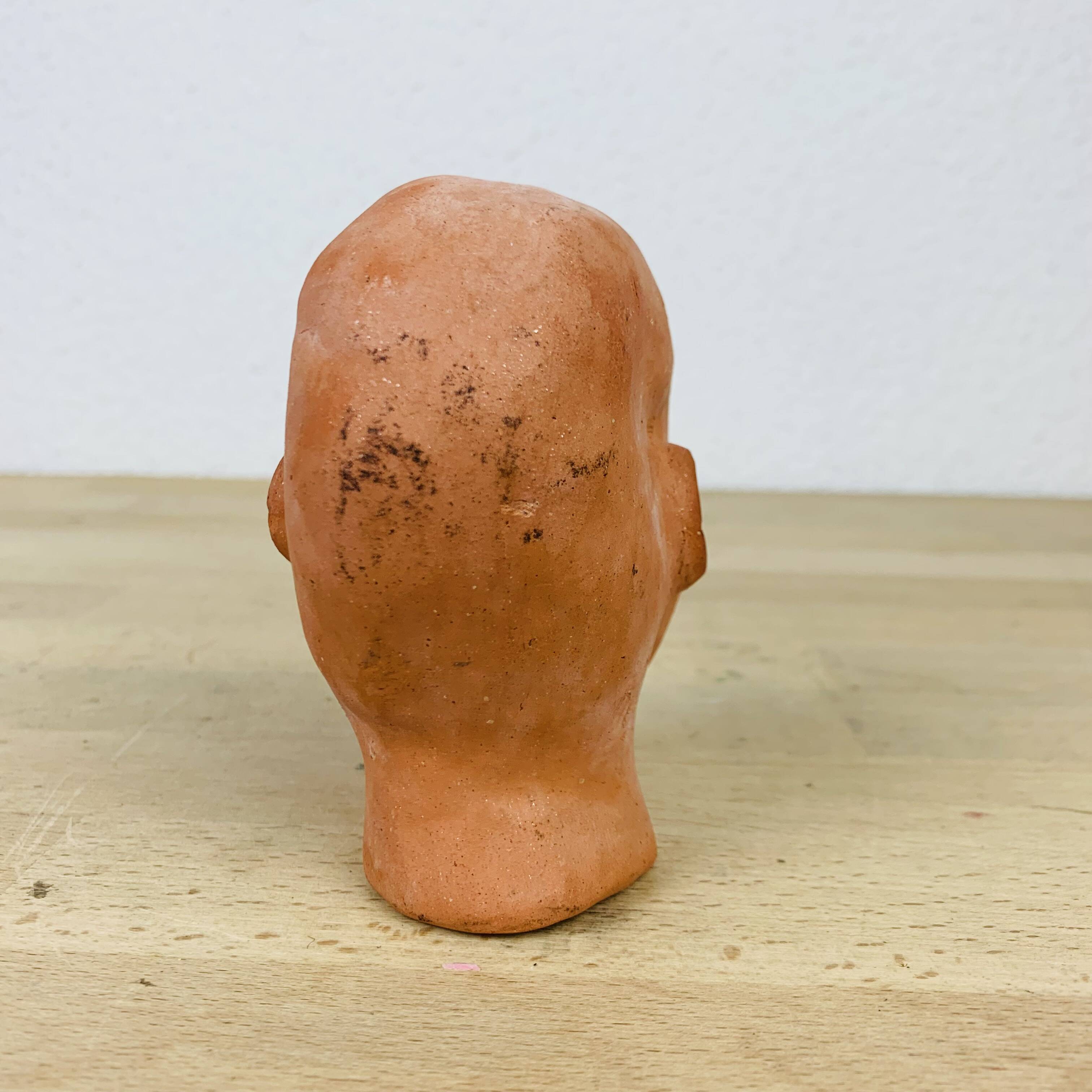 Terracotta head/bust, object of curiosity