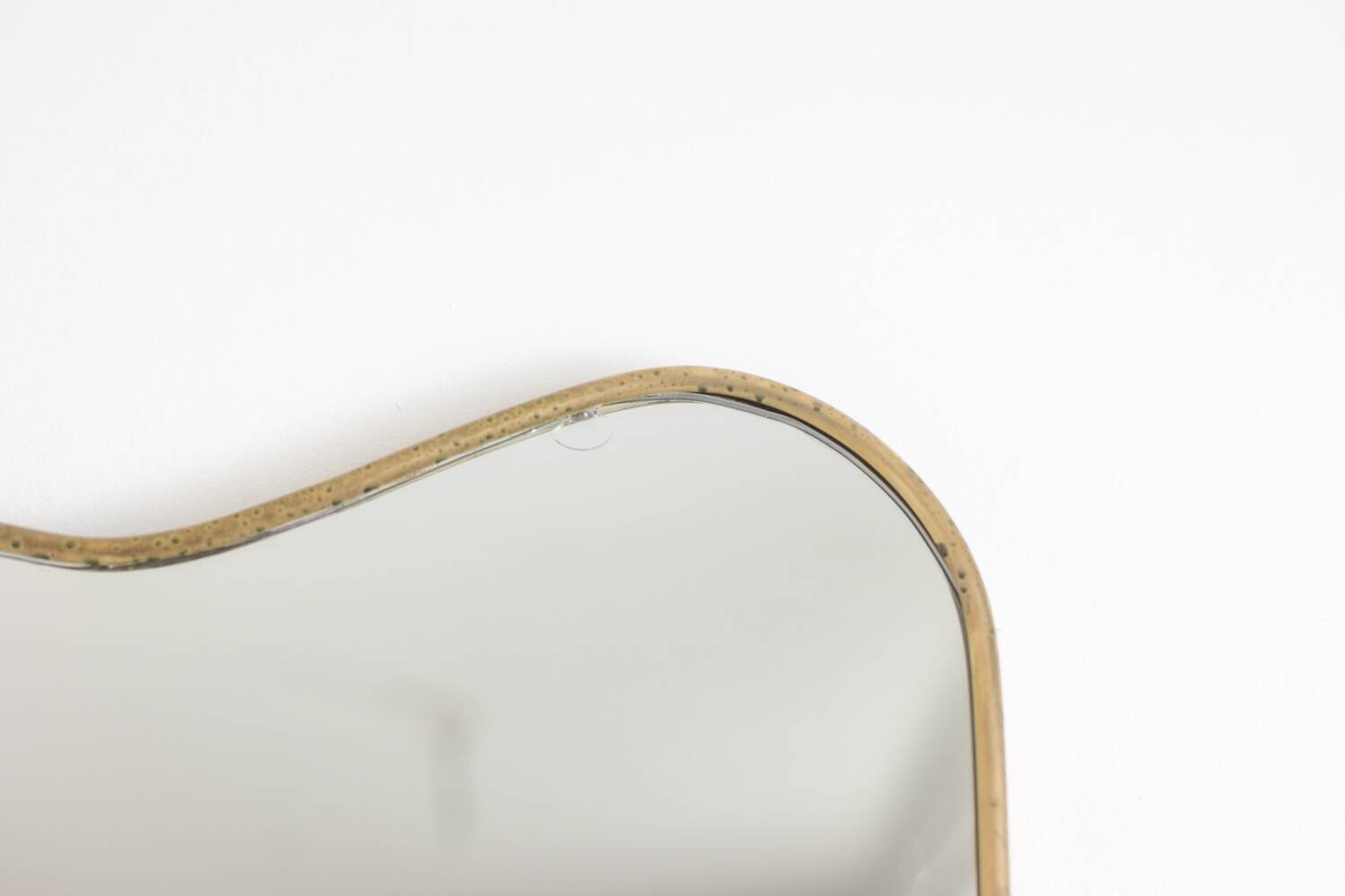 Mirror with a gilded brass frame. 1980s.