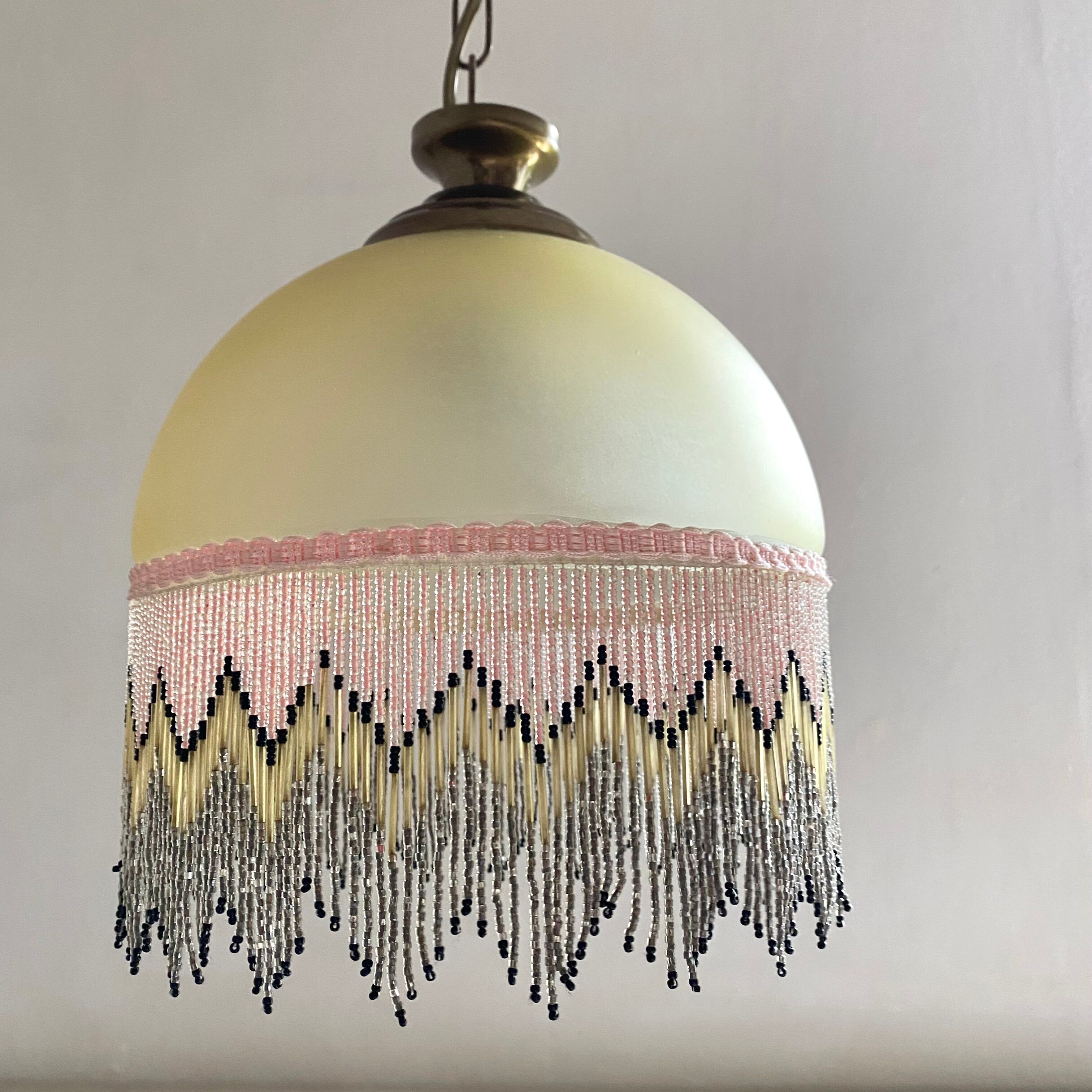 Pendant light in frosted glass and beads