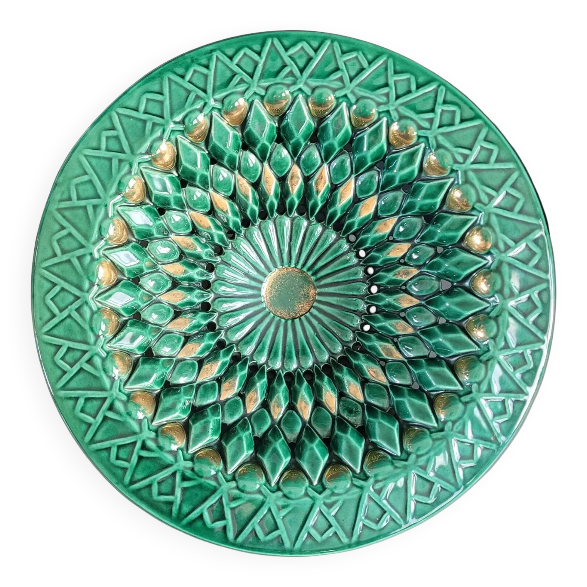 Large pierced earthenware fruit bowl glazed in green and gold.