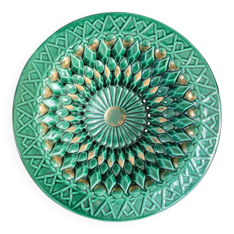 Large pierced earthenware fruit bowl glazed in green and gold.