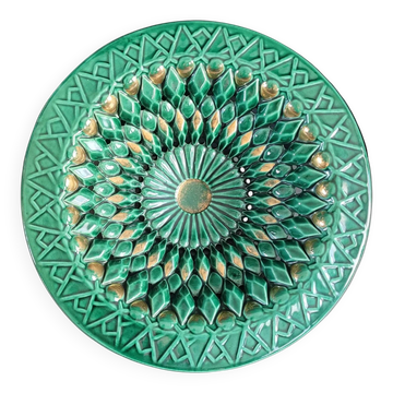 Large pierced earthenware fruit bowl glazed in green and gold.