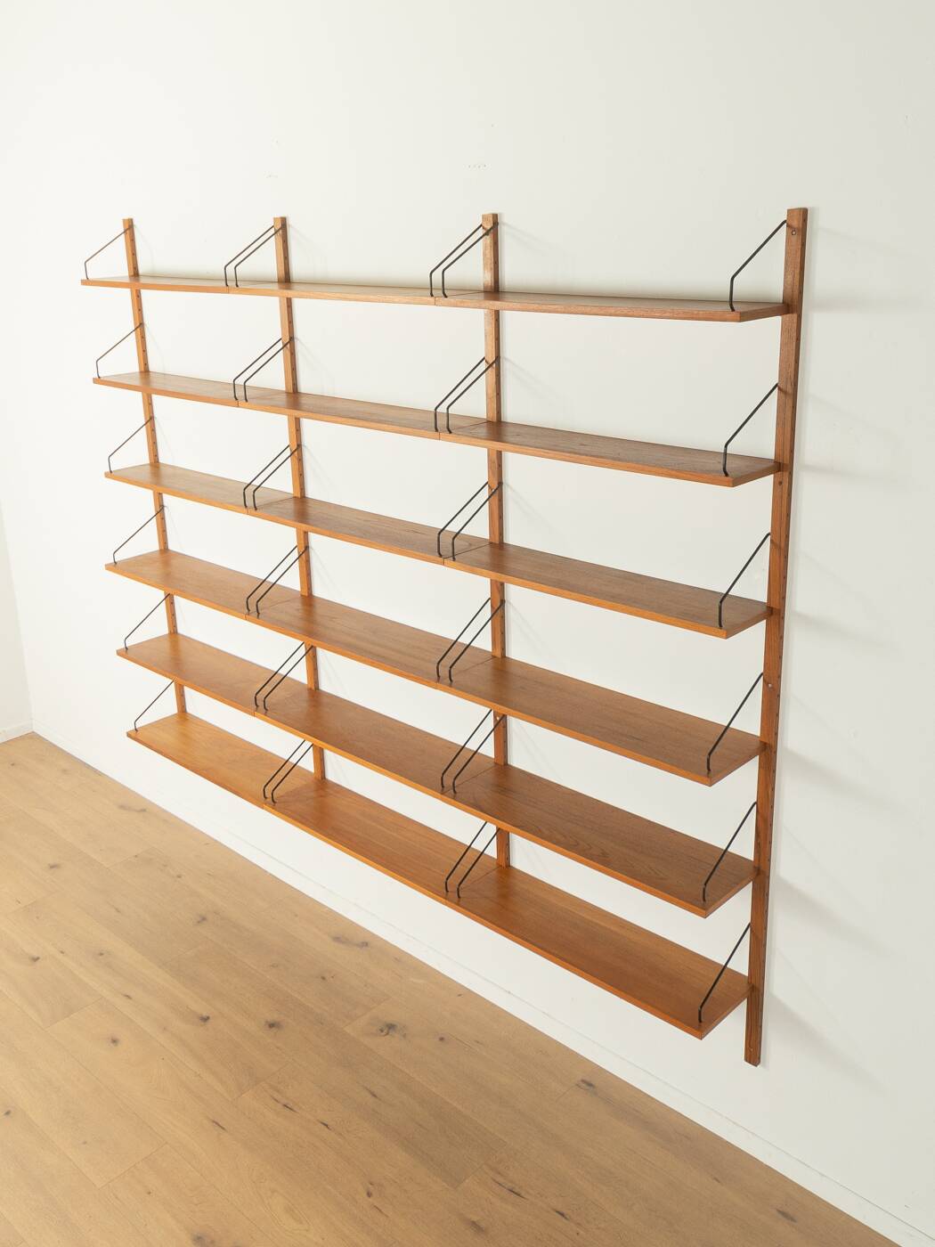 Classic wall shelf by Poul Cadovius for Cado, 1950s, teak veneer, 18 shelves, 4 ladders, Denmark