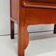 Antique red cabinet with brass details
