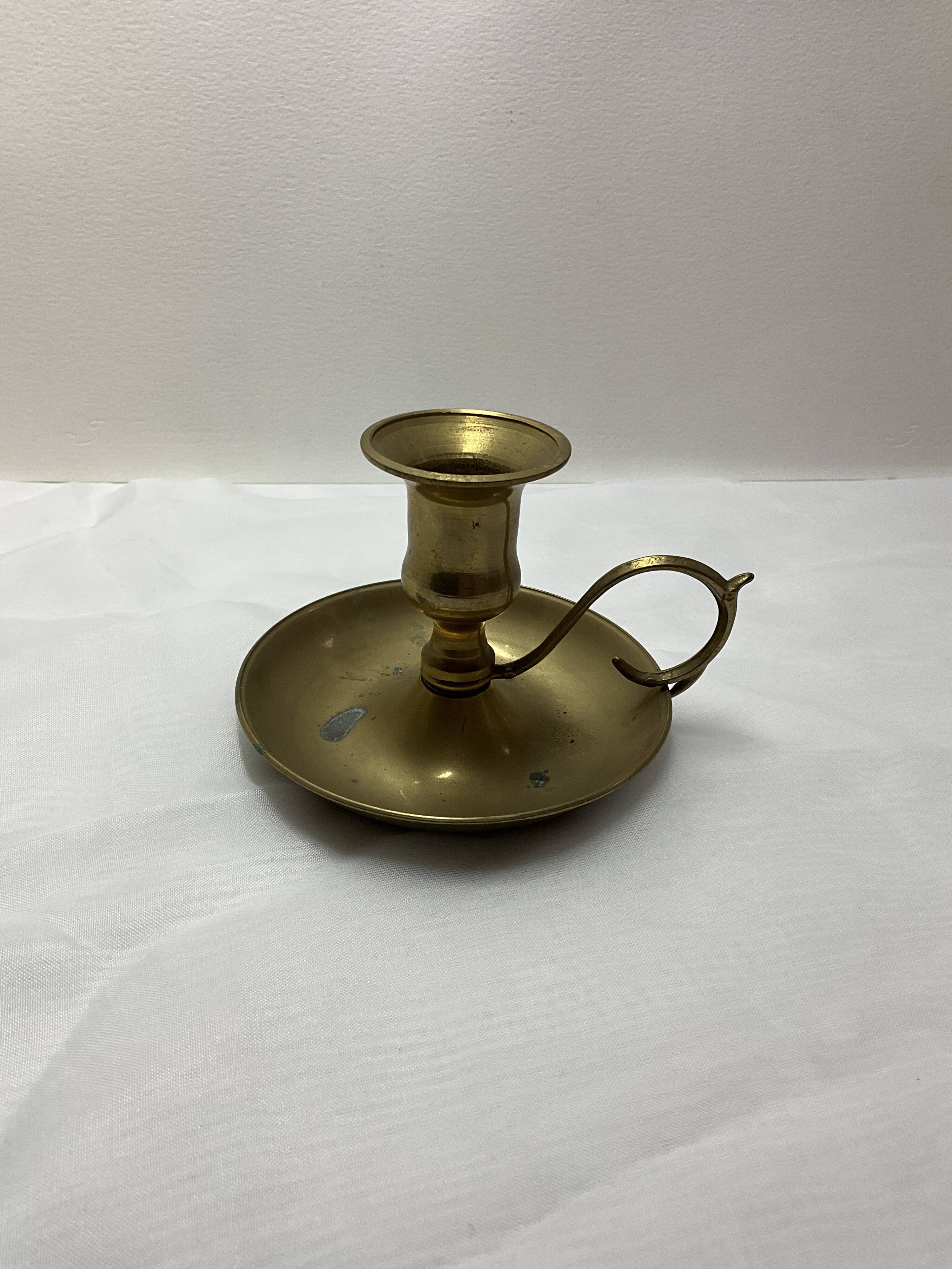 Brass hand candle holder