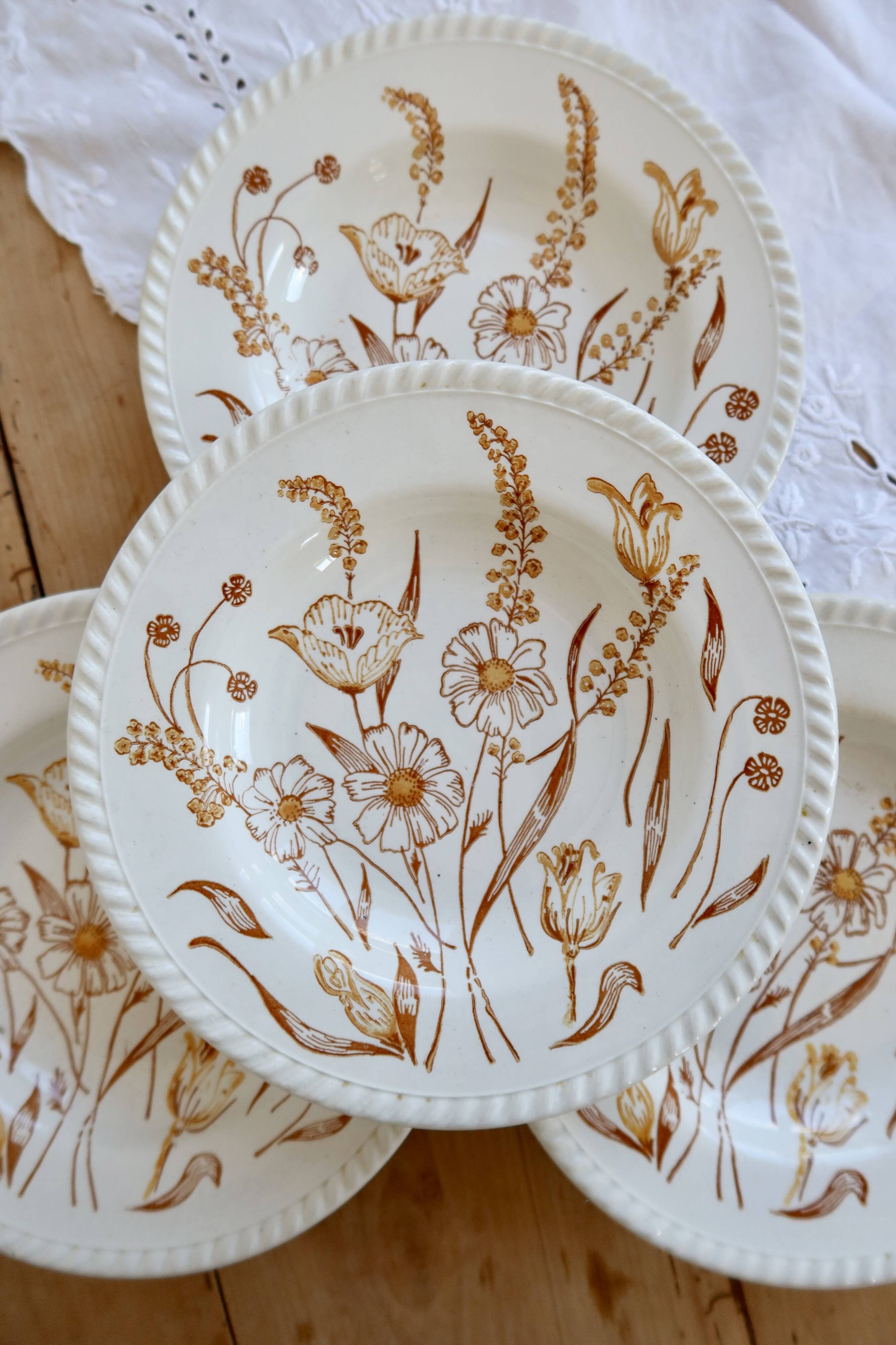 4 vintage deep plates with a brown floral design