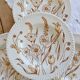 4 vintage deep plates with a brown floral design