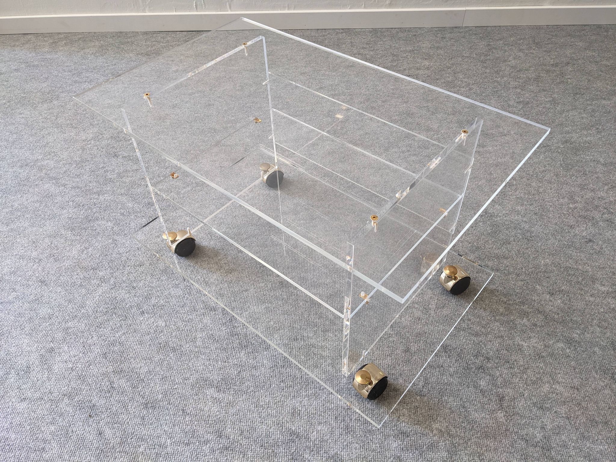 David Lange side table on wheels in plexiglass, France 1970.