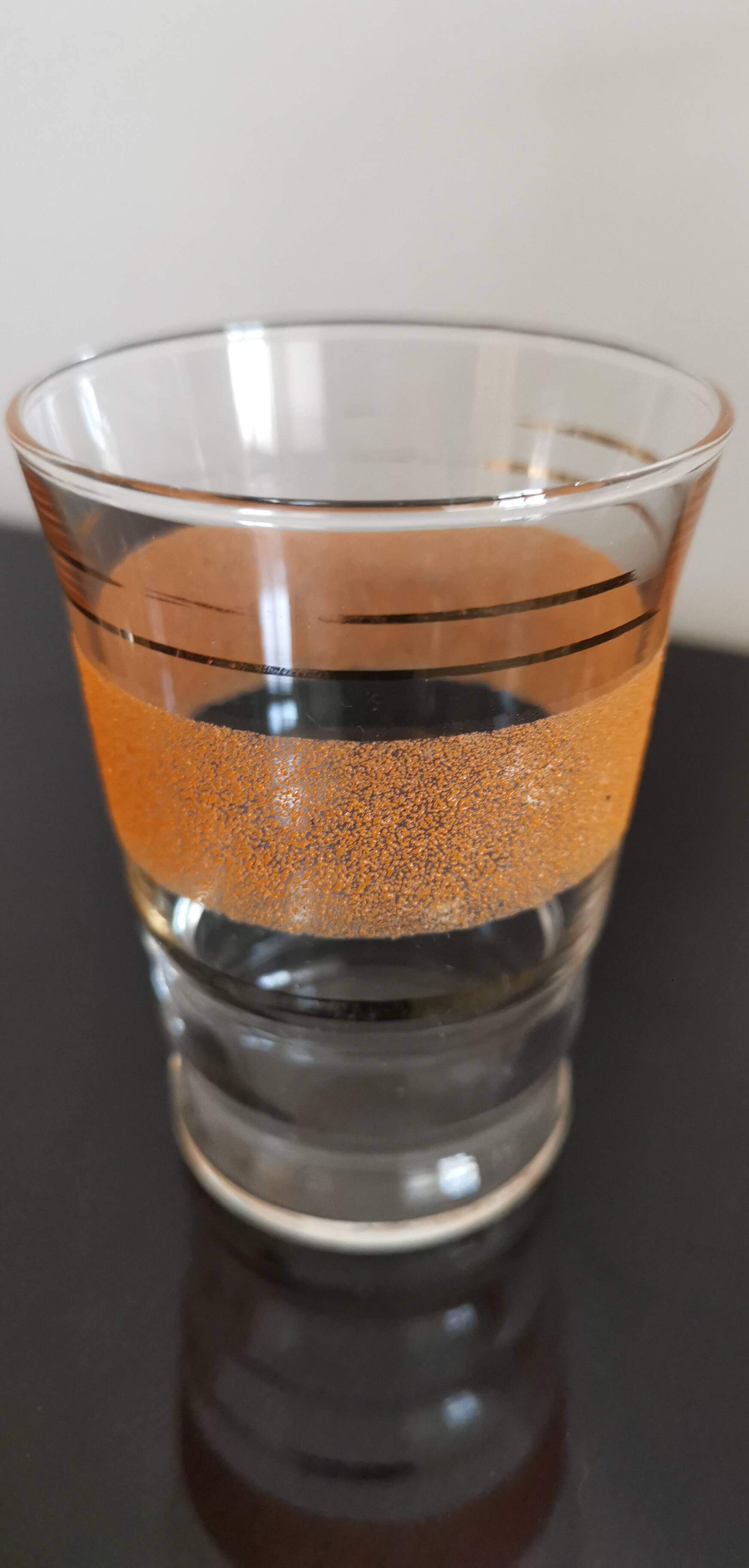 Set of 4 colored granite glasses with its carafe