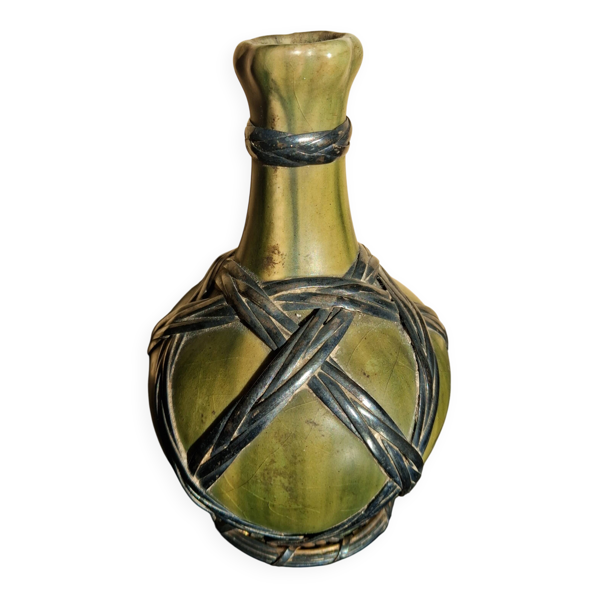 Miniature vase encircled with woven black brass.