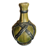 Miniature vase encircled with woven black brass.