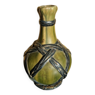 Miniature vase encircled with woven black brass.