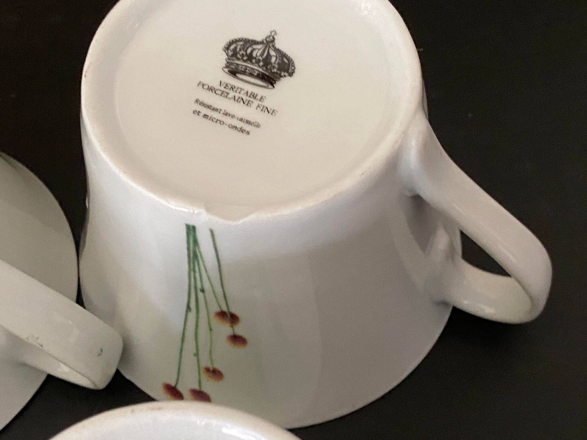 4 fine white porcelain cups with fine flower decoration