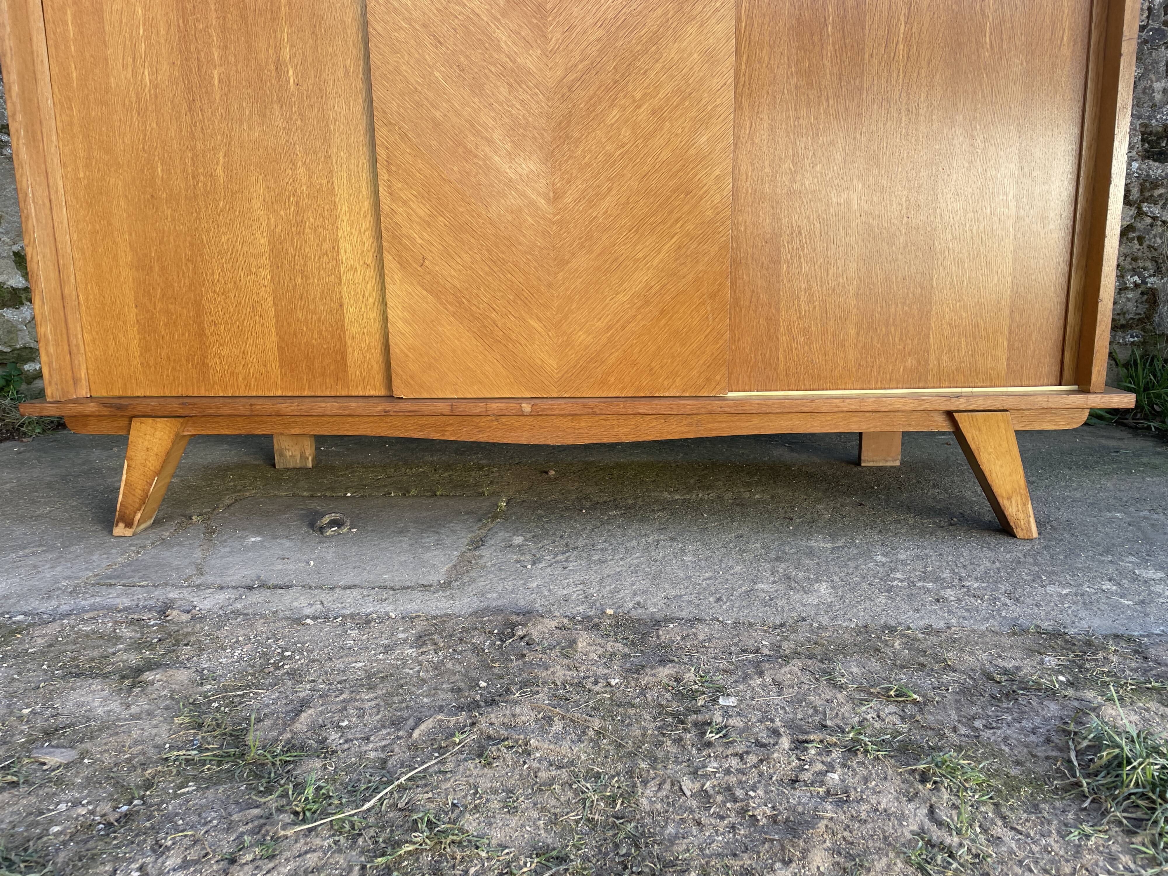 Light oak sliding door wardrobe, 1960